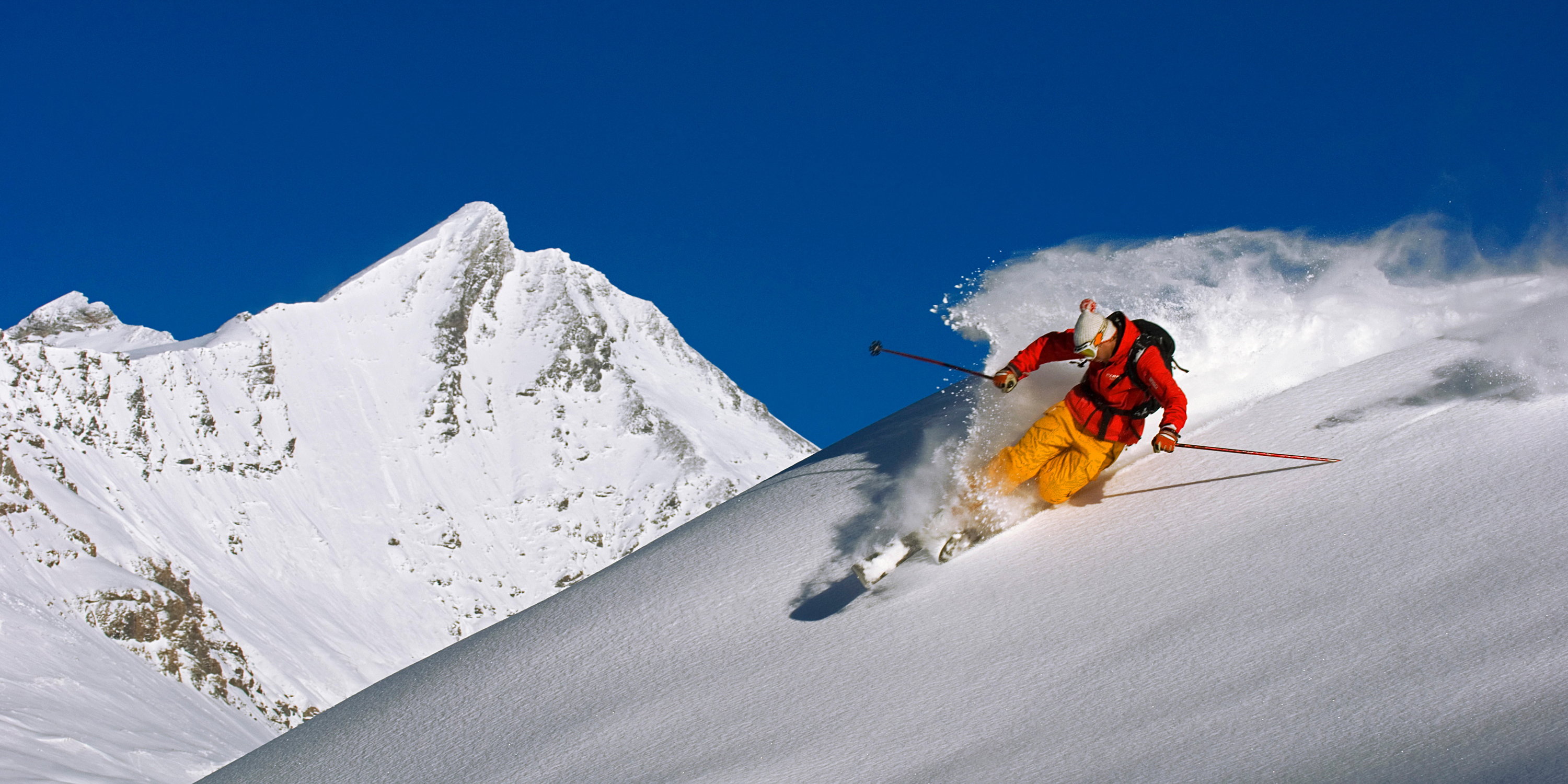 A skiier performing a telemark in Tignes, France