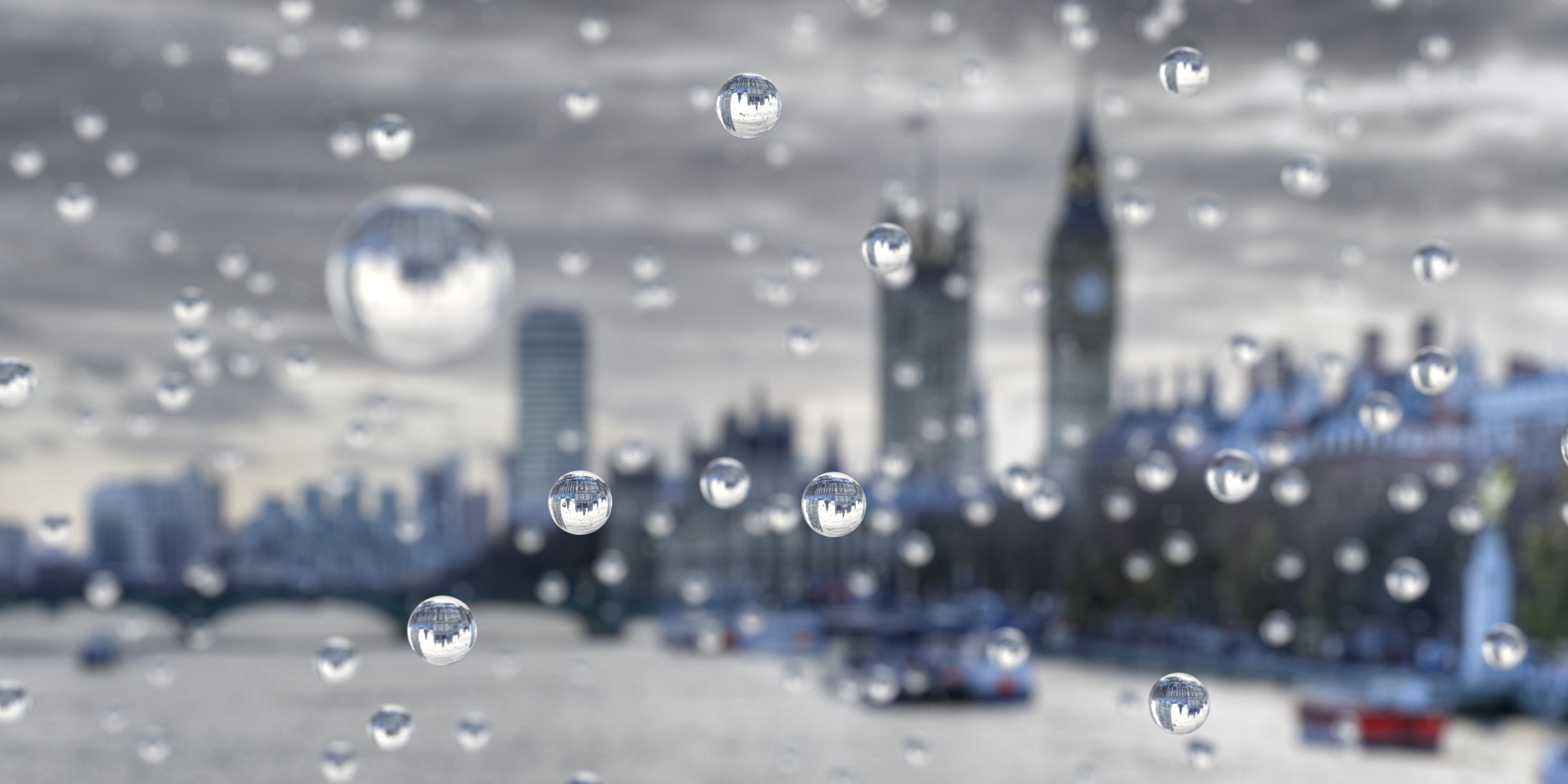 Raindrops on a windowpane looking out across the London cityscape